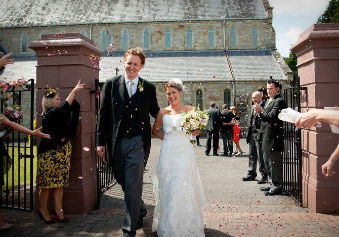wedding photos confetti throwing bride and groom. Tara Aherne Photography Throwing confetti bride and groom wedding ireland